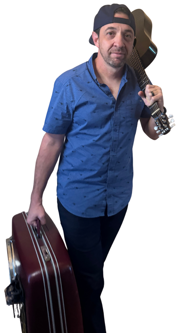 Sean Eddy, North Texas one-man band, carrying his guitar and suitcase drum